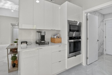 This stunning 3-bedroom, 2-bath waterfront home has it on Boca Raton Municipal Golf Course in Florida - for sale on GolfHomes.com, golf home, golf lot