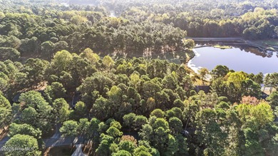 Golf front lot located on the fairway of the 11th hole of the 7 on Seven Lakes Country Club in North Carolina - for sale on GolfHomes.com, golf home, golf lot