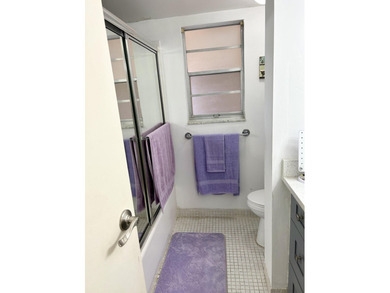 Beautiful view from balcony of golf course and water this 2/2 is on Poinciana Golf Club in Florida - for sale on GolfHomes.com, golf home, golf lot