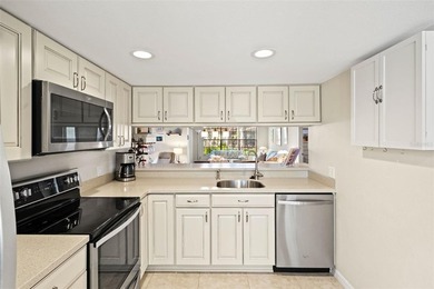 PENDING.  A MUST SEE!  Impeccably maintained, UPDATED, End unit on Timber Pines Golf Course in Florida - for sale on GolfHomes.com, golf home, golf lot