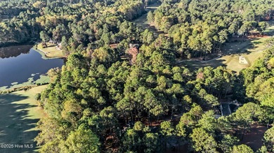 Golf front lot located on the fairway of the 11th hole of the 7 on Seven Lakes Country Club in North Carolina - for sale on GolfHomes.com, golf home, golf lot