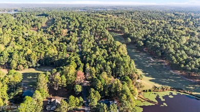 Golf front lot located on the fairway of the 11th hole of the 7 on Seven Lakes Country Club in North Carolina - for sale on GolfHomes.com, golf home, golf lot