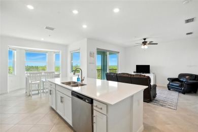 TOP FLOOR Birkdale floorplan with spectacular water and nature on Heritage Landing Golf  in Florida - for sale on GolfHomes.com, golf home, golf lot