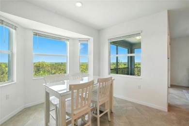 TOP FLOOR Birkdale floorplan with spectacular water and nature on Heritage Landing Golf  in Florida - for sale on GolfHomes.com, golf home, golf lot