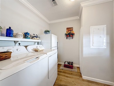 INTRODUCING this VERY unique, yet MODERN, hurricane RESISTANT on Lily Lake Golf and RV Resort in Florida - for sale on GolfHomes.com, golf home, golf lot