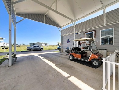 INTRODUCING this VERY unique, yet MODERN, hurricane RESISTANT on Lily Lake Golf and RV Resort in Florida - for sale on GolfHomes.com, golf home, golf lot