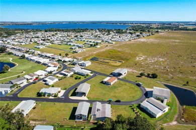 INTRODUCING this VERY unique, yet MODERN, hurricane RESISTANT on Lily Lake Golf and RV Resort in Florida - for sale on GolfHomes.com, golf home, golf lot
