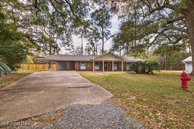 Welcome home this charming Fort Bayou Estates rancher with on Gulf Hills Golf Club in Mississippi - for sale on GolfHomes.com, golf home, golf lot