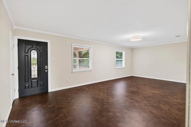 Welcome home this charming Fort Bayou Estates rancher with on Gulf Hills Golf Club in Mississippi - for sale on GolfHomes.com, golf home, golf lot