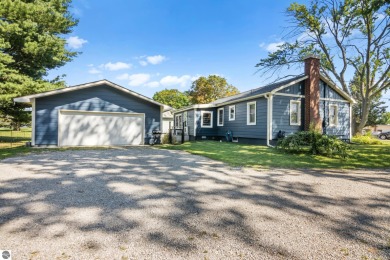 This four bedroom house with a double lot checks all the boxes on Elk Rapids Golf Club in Michigan - for sale on GolfHomes.com, golf home, golf lot