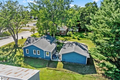 This four bedroom house with a double lot checks all the boxes on Elk Rapids Golf Club in Michigan - for sale on GolfHomes.com, golf home, golf lot