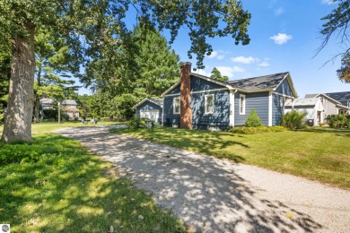 This four bedroom house with a double lot checks all the boxes on Elk Rapids Golf Club in Michigan - for sale on GolfHomes.com, golf home, golf lot