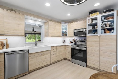 This impeccably remodeled 3 bdr residence is a true standout In on Woodmont Country Club in Florida - for sale on GolfHomes.com, golf home, golf lot