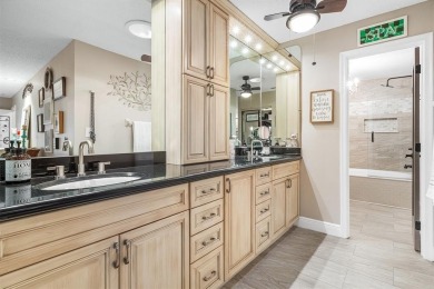 This impeccably remodeled 3 bdr residence is a true standout In on Woodmont Country Club in Florida - for sale on GolfHomes.com, golf home, golf lot
