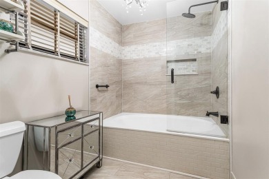 This impeccably remodeled 3 bdr residence is a true standout In on Woodmont Country Club in Florida - for sale on GolfHomes.com, golf home, golf lot