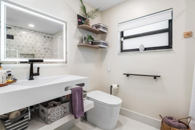 This impeccably remodeled 3 bdr residence is a true standout In on Woodmont Country Club in Florida - for sale on GolfHomes.com, golf home, golf lot