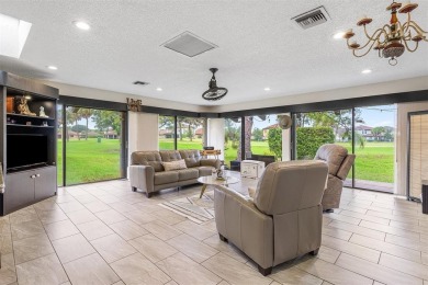 This impeccably remodeled 3 bdr residence is a true standout In on Woodmont Country Club in Florida - for sale on GolfHomes.com, golf home, golf lot