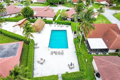 This impeccably remodeled 3 bdr residence is a true standout In on Woodmont Country Club in Florida - for sale on GolfHomes.com, golf home, golf lot
