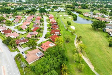 This impeccably remodeled 3 bdr residence is a true standout In on Woodmont Country Club in Florida - for sale on GolfHomes.com, golf home, golf lot