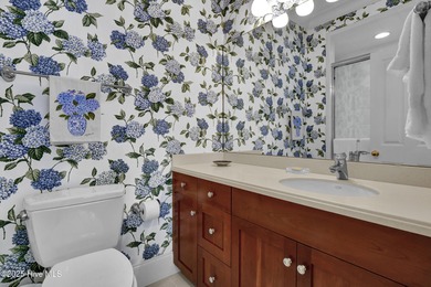 Gorgeous custom-built brick home on a 0.71 acre lot on fairway on Country Club of Landfall in North Carolina - for sale on GolfHomes.com, golf home, golf lot