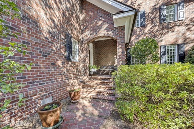 Gorgeous custom-built brick home on a 0.71 acre lot on fairway on Country Club of Landfall in North Carolina - for sale on GolfHomes.com, golf home, golf lot