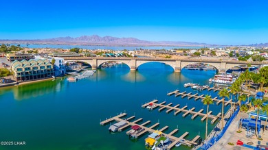 LOCATED IN THE LUXURIOUS QUEENS BAY RESORT! This beautifully on London Bridge Golf Course in Arizona - for sale on GolfHomes.com, golf home, golf lot