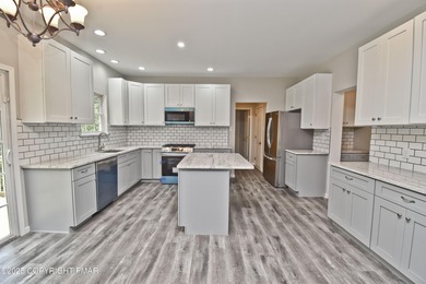 COMPLETELY RENOVATED & MOVE-IN READY! This STUNNING 4bd/2.5ba on Country Club of the Poconos Golf Course in Pennsylvania - for sale on GolfHomes.com, golf home, golf lot