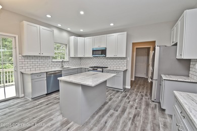 COMPLETELY RENOVATED & MOVE-IN READY! This STUNNING 4bd/2.5ba on Country Club of the Poconos Golf Course in Pennsylvania - for sale on GolfHomes.com, golf home, golf lot