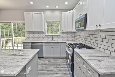 COMPLETELY RENOVATED & MOVE-IN READY! This STUNNING 4bd/2.5ba on Country Club of the Poconos Golf Course in Pennsylvania - for sale on GolfHomes.com, golf home, golf lot