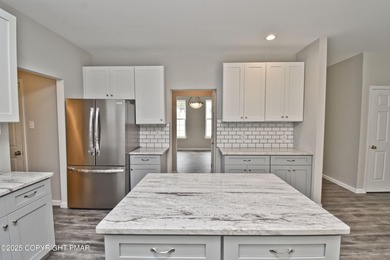 COMPLETELY RENOVATED & MOVE-IN READY! This STUNNING 4bd/2.5ba on Country Club of the Poconos Golf Course in Pennsylvania - for sale on GolfHomes.com, golf home, golf lot