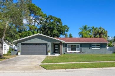 Welcome to this beautifully remodeled 3 bedroom, 2 bathroom pool on Mangrove Bay Golf Course in Florida - for sale on GolfHomes.com, golf home, golf lot