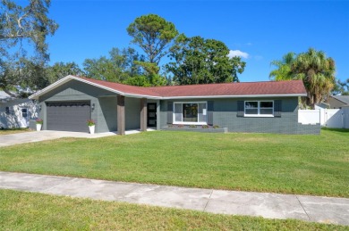 Welcome to this beautifully remodeled 3 bedroom, 2 bathroom pool on Mangrove Bay Golf Course in Florida - for sale on GolfHomes.com, golf home, golf lot