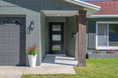 Welcome to this beautifully remodeled 3 bedroom, 2 bathroom pool on Mangrove Bay Golf Course in Florida - for sale on GolfHomes.com, golf home, golf lot
