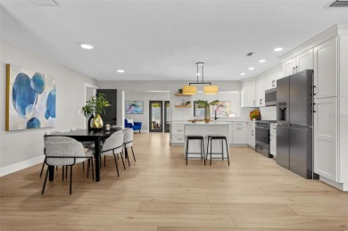 Welcome to this beautifully remodeled 3 bedroom, 2 bathroom pool on Mangrove Bay Golf Course in Florida - for sale on GolfHomes.com, golf home, golf lot