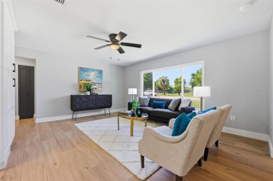Welcome to this beautifully remodeled 3 bedroom, 2 bathroom pool on Mangrove Bay Golf Course in Florida - for sale on GolfHomes.com, golf home, golf lot