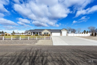 This stunning property offers an 18-ft garage door with an RV on River Bend Golf Course in Idaho - for sale on GolfHomes.com, golf home, golf lot