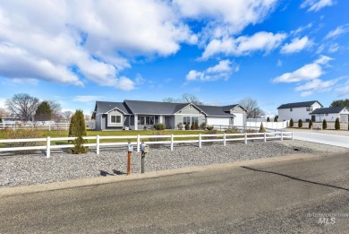 This stunning property offers an 18-ft garage door with an RV on River Bend Golf Course in Idaho - for sale on GolfHomes.com, golf home, golf lot