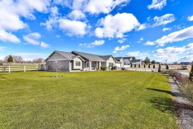 This stunning property offers an 18-ft garage door with an RV on River Bend Golf Course in Idaho - for sale on GolfHomes.com, golf home, golf lot