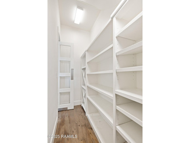 Charming 5-Bedroom Acadian-Style Home with Park Views in Sugar on Les Vieux Chenes Golf Course in Louisiana - for sale on GolfHomes.com, golf home, golf lot