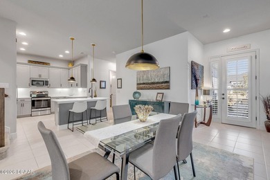 Experience modern Florida living in this stunning two-story home on Plantation Bay Golf and Country Club in Florida - for sale on GolfHomes.com, golf home, golf lot