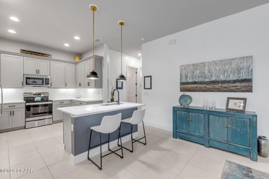 Experience modern Florida living in this stunning two-story home on Plantation Bay Golf and Country Club in Florida - for sale on GolfHomes.com, golf home, golf lot