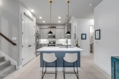 Experience modern Florida living in this stunning two-story home on Plantation Bay Golf and Country Club in Florida - for sale on GolfHomes.com, golf home, golf lot