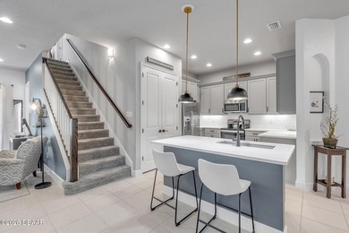 Experience modern Florida living in this stunning two-story home on Plantation Bay Golf and Country Club in Florida - for sale on GolfHomes.com, golf home, golf lot