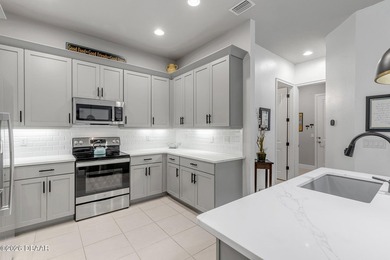 Experience modern Florida living in this stunning two-story home on Plantation Bay Golf and Country Club in Florida - for sale on GolfHomes.com, golf home, golf lot