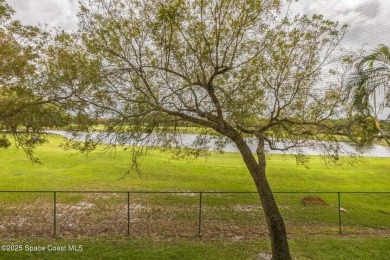 Wake up to lake and golf course views from this bright and on  in Florida - for sale on GolfHomes.com, golf home, golf lot