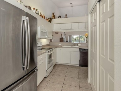Beautiful Waterside Village condo with wonderful water and on Pelican Pointe Golf and Country Club in Florida - for sale on GolfHomes.com, golf home, golf lot