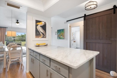 COASTAL COMFORT BEAUTY! This spectacular PAR FOUR second floor on Capri Isle Golf Club in Florida - for sale on GolfHomes.com, golf home, golf lot