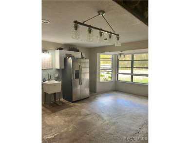 This 3-bedroom 2-bath home is nested in a quiet community in the on Plantation Inn and Golf Resort  in Florida - for sale on GolfHomes.com, golf home, golf lot