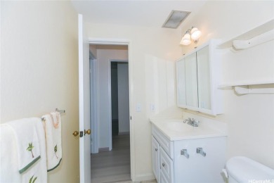 This coveted first-floor *A* unit (2BR/1BA) is ideally located on Makaha Valley Country Club in Hawaii - for sale on GolfHomes.com, golf home, golf lot