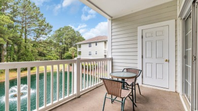 Pond and golf course views from the covered porch on this great on Barefoot Resort and Golf Club  in South Carolina - for sale on GolfHomes.com, golf home, golf lot